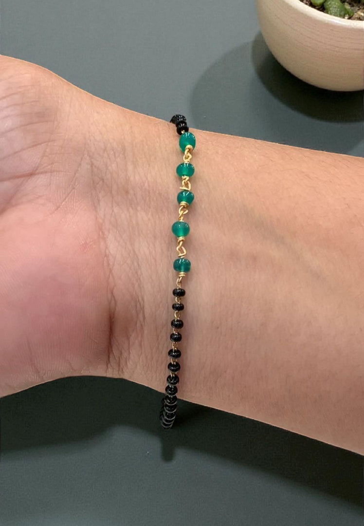 Beautiful black beads bracelet with green stone