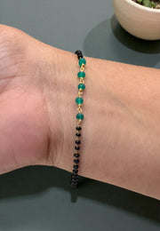 Beautiful black beads bracelet with green stone