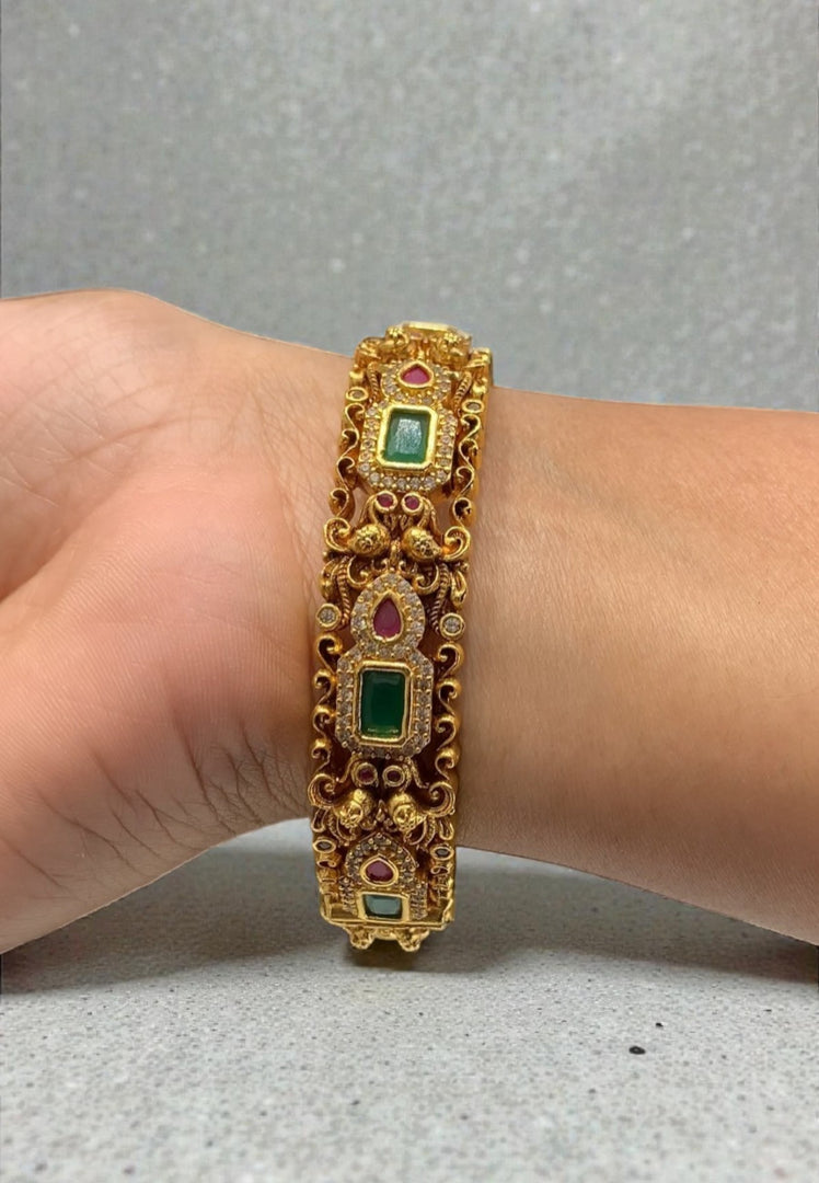 Traditional nakshi bangle with green and pink stone