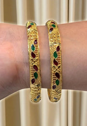 Beautiful gold finishing bangles with ruby and green stone