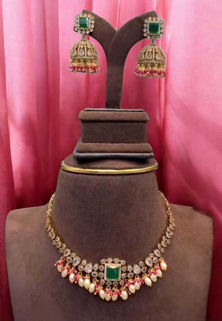 Beautiful short necklace with white hangings and green stone