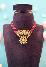 Beautiful short necklace with Red colour beads chain with four lines -attached with peacock design pendant