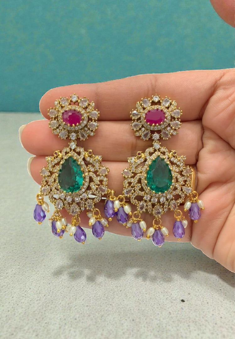 Beautiful earrings with purple stone