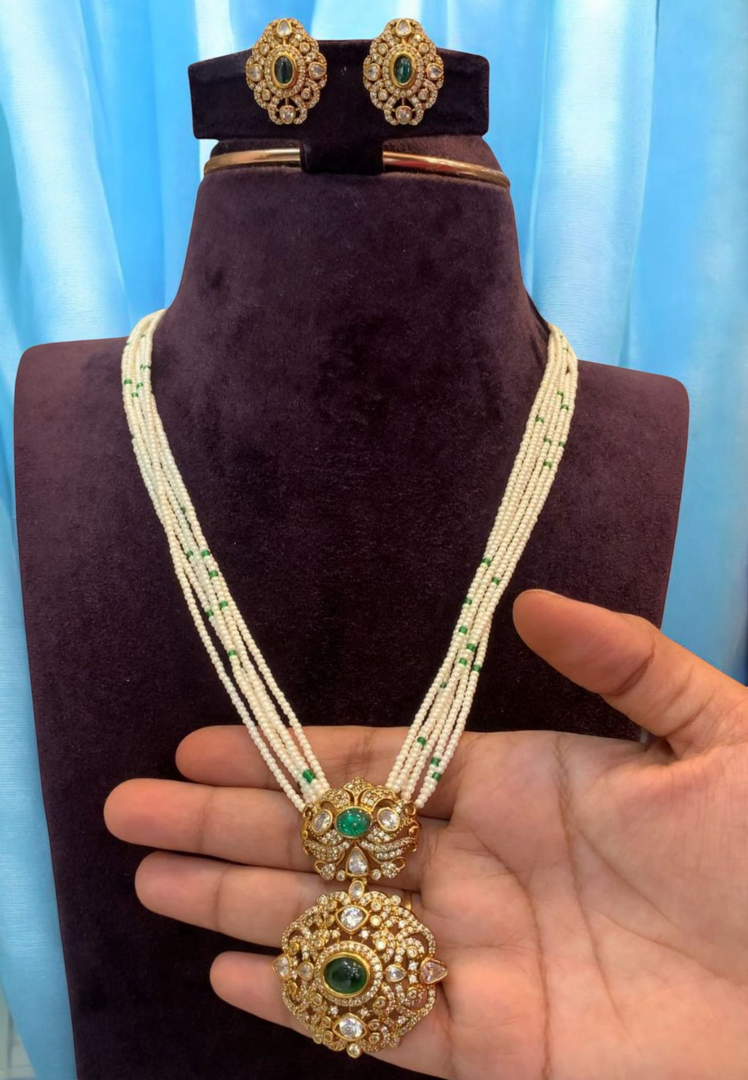 Beautiful white pearl mala with green stone pendant