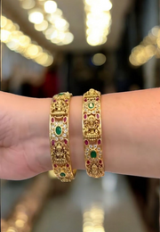 Beautiful goddess motive bangles with green and Ruby stones