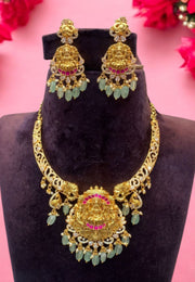 Kanti necklace with God laxmi motive pendant and light blue colour stones and guttapusalu hangings