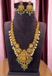 Beautiful long haram with green beats and white pearls hangings