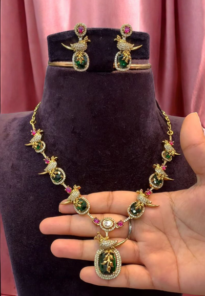 Beautiful short necklace with peacock design and green stone