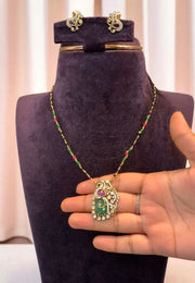 Beautiful black beads chain with green and pink stone