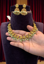 Load image into Gallery viewer, Beautiful short necklace with green stone and Laxmi Devi motive

