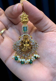 Beautiful tikka with green stone and Laxmi Devi motive