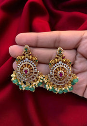 Beautiful earrings with green beads and pink stone