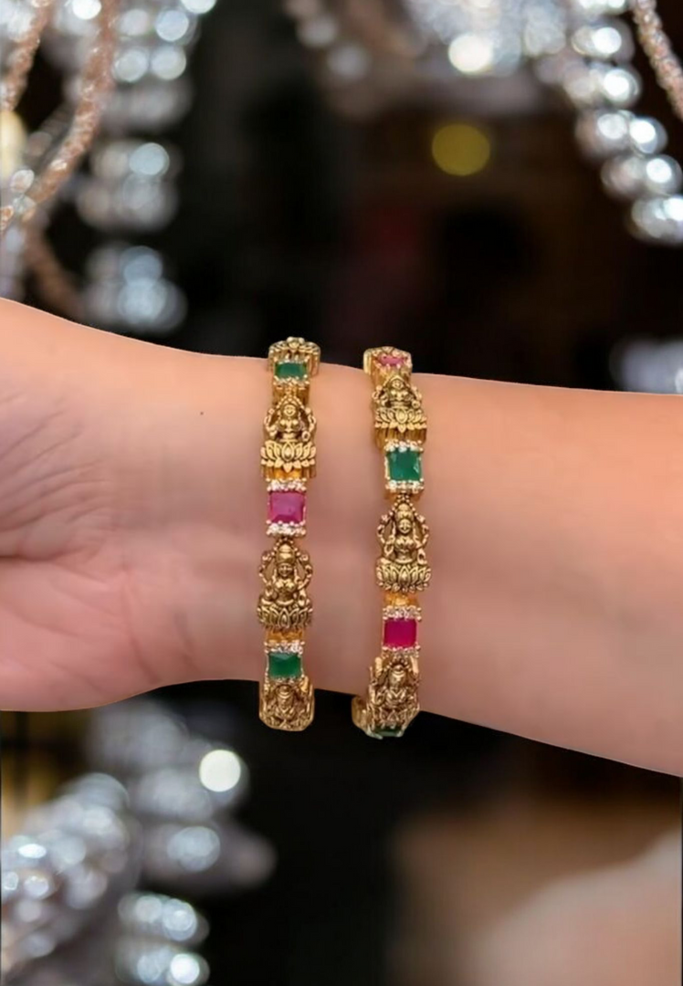 Beautiful bangles with goddess motive and green and Ruby stones