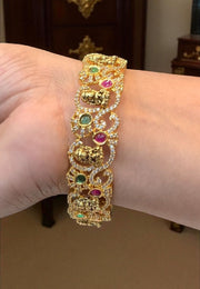 Beautiful nakshi bangles with Laxmi Devi motive and green, pink stone