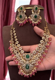 Beautiful short necklace with diamond look and green stones with light Ruby stone hangings